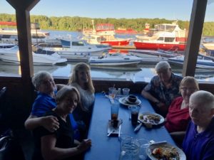 Image shows Writing Works Wonders on the road in Albany New York CHERYL and Kathy with friends at dinner, Kathy, John, Diane and Ed.